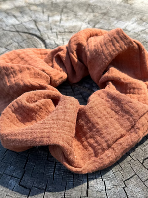 Scrunchie on a textured wooden surface