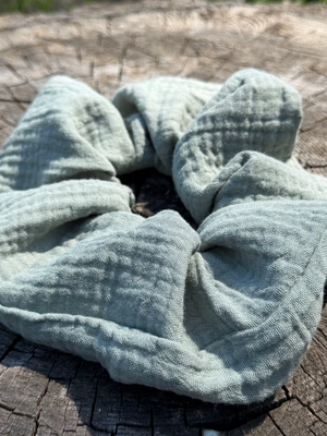 Light blue textured towel on a wooden surface